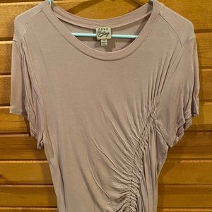 Size small. A very light pink/purple shirt sleeve side front detail top.